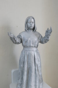 Detailaufnahme: Engelsfigur aus Bronze